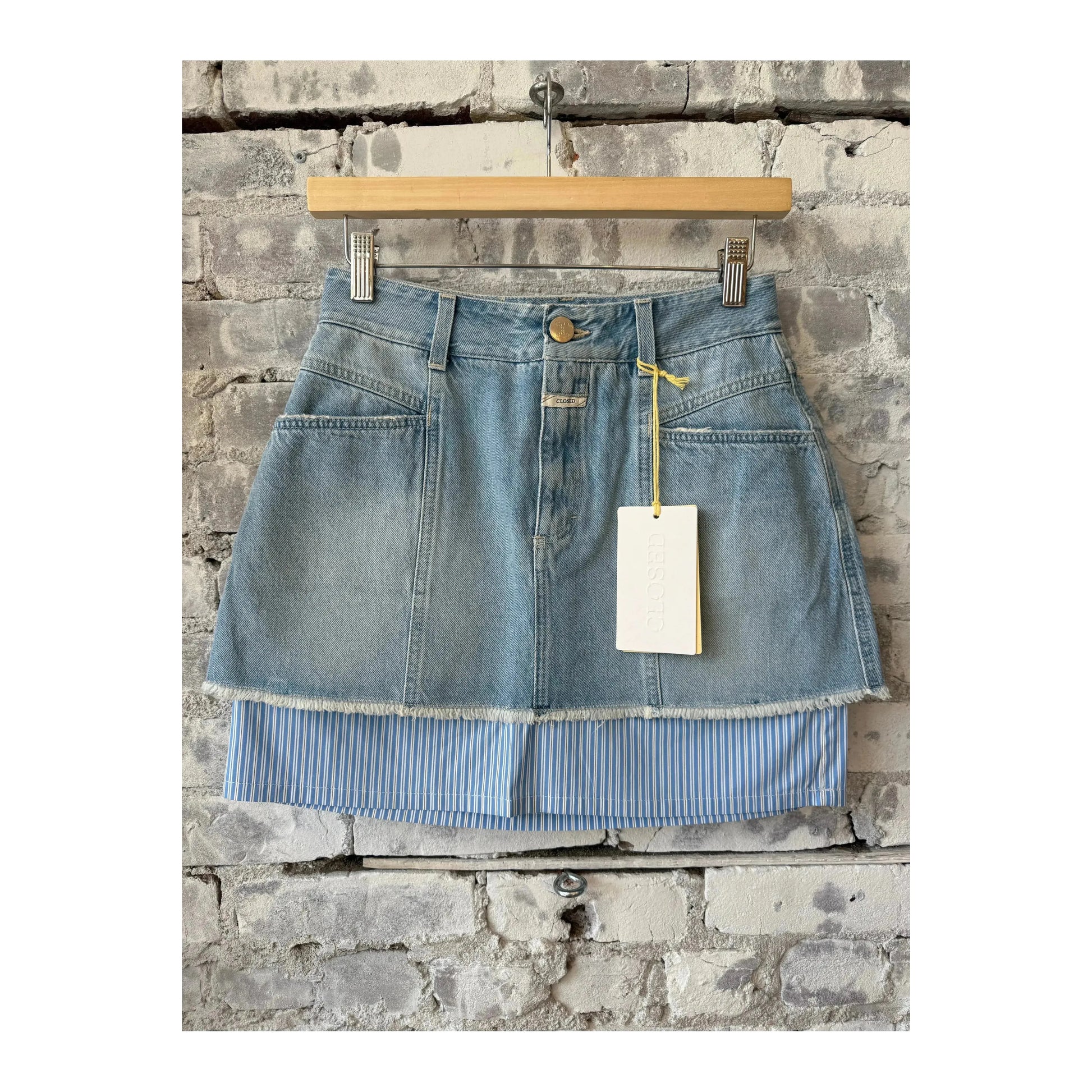 Light blue women's denim poplin mini skirt by Closed Women's, showing the fitted high-waist style and classic denim texture.