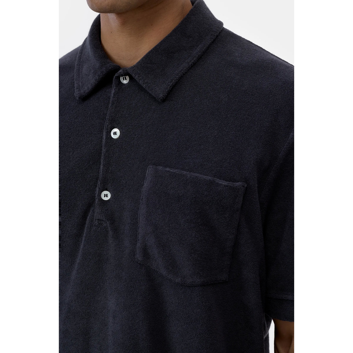 Men's short sleeve polo shirt in Magma Black by Closed Men's, featuring a classic collar and comfortable fit.