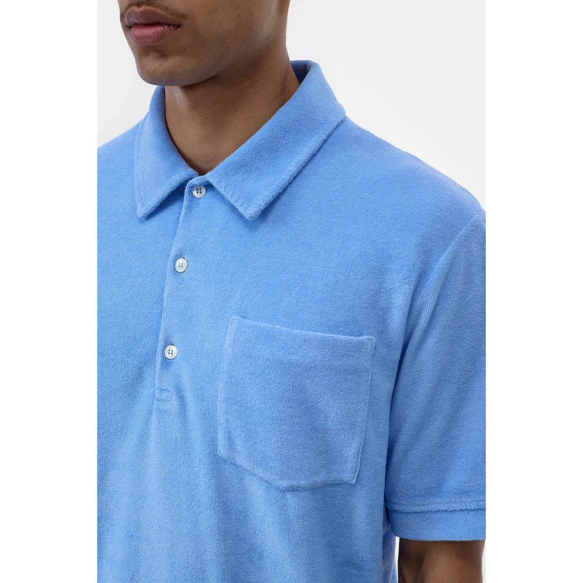 Men's sky blue short sleeve polo shirt by Closed Men's, shown flat with collar and buttons, casual and comfortable style.