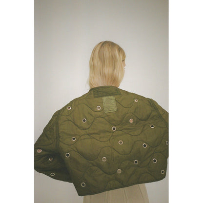 Women's military liner grommets in navy by Sloppy Seconds, showing close-up of metal grommets on fabric.