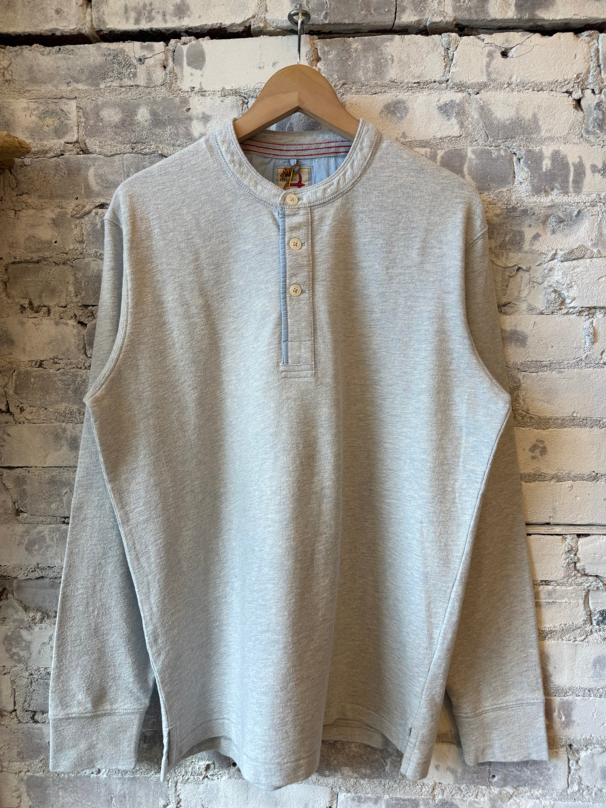 Men's Relwen Slub Jersey Henley in ice blue heather, showcasing the textured fabric, buttoned collar, and casual fit.