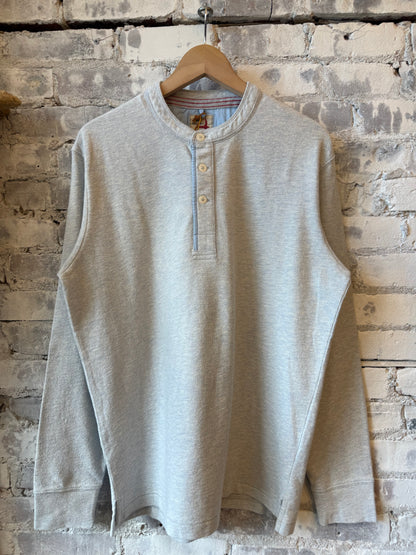 Men's Relwen Slub Jersey Henley in ice blue heather, showcasing the textured fabric, buttoned collar, and casual fit.