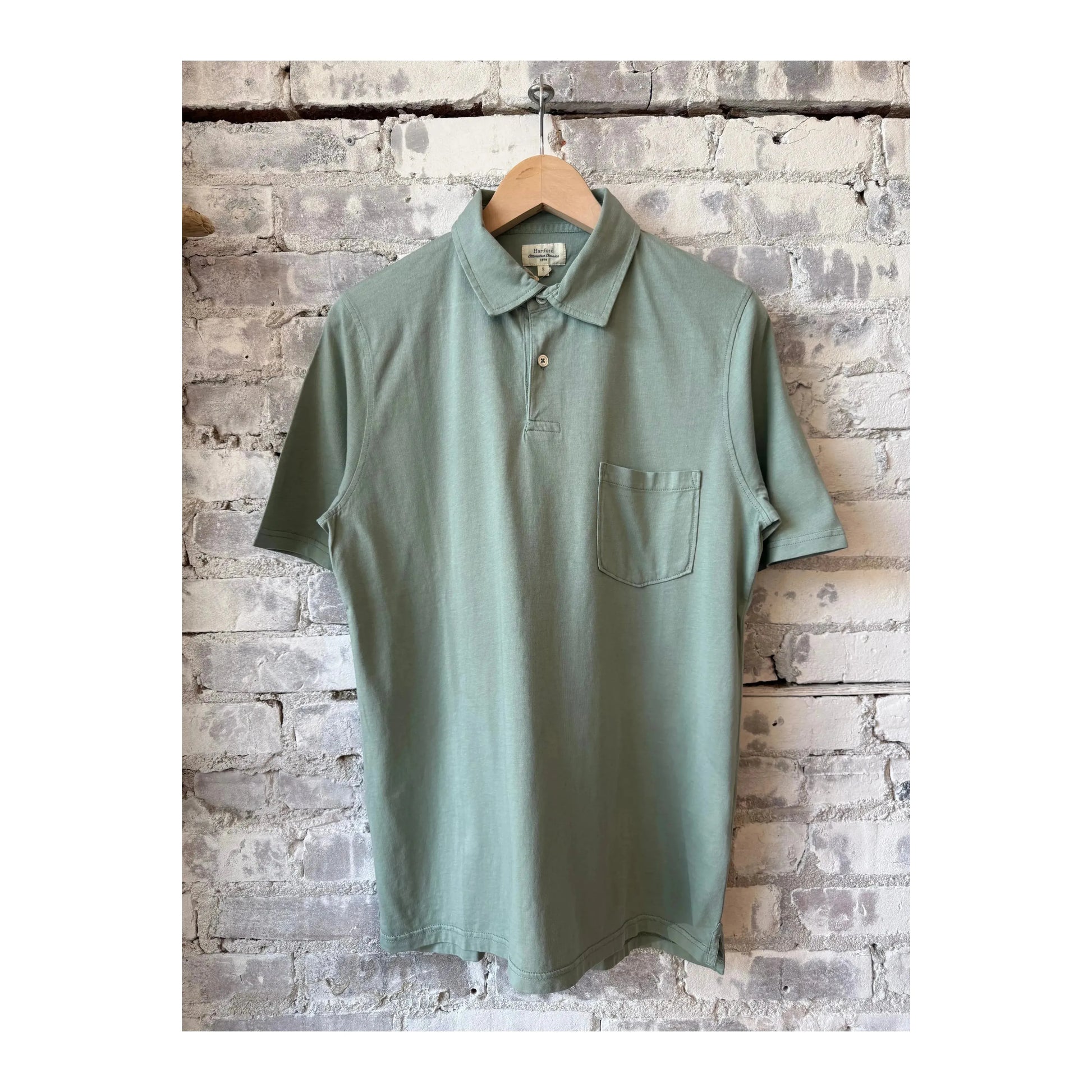 Men's Hartford SS Cotton Jersey Polo in faded green, showcasing the casual fit and soft cotton fabric.
