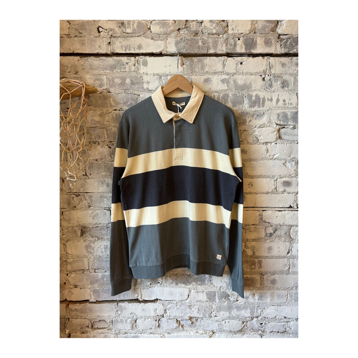 Men's sueded rugby polo in stormy weather colorblock by Marine Layer, showing the shirt's textured fabric and colorblock design.