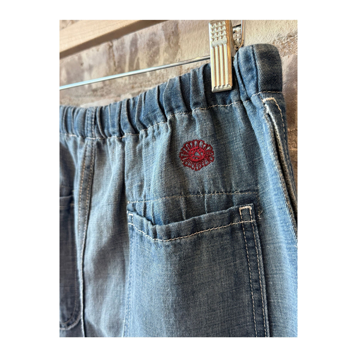 Men's Sunny Afternoon Short in light wash chambray by MONOSTERO, featuring a casual fit with a relaxed, stylish look.