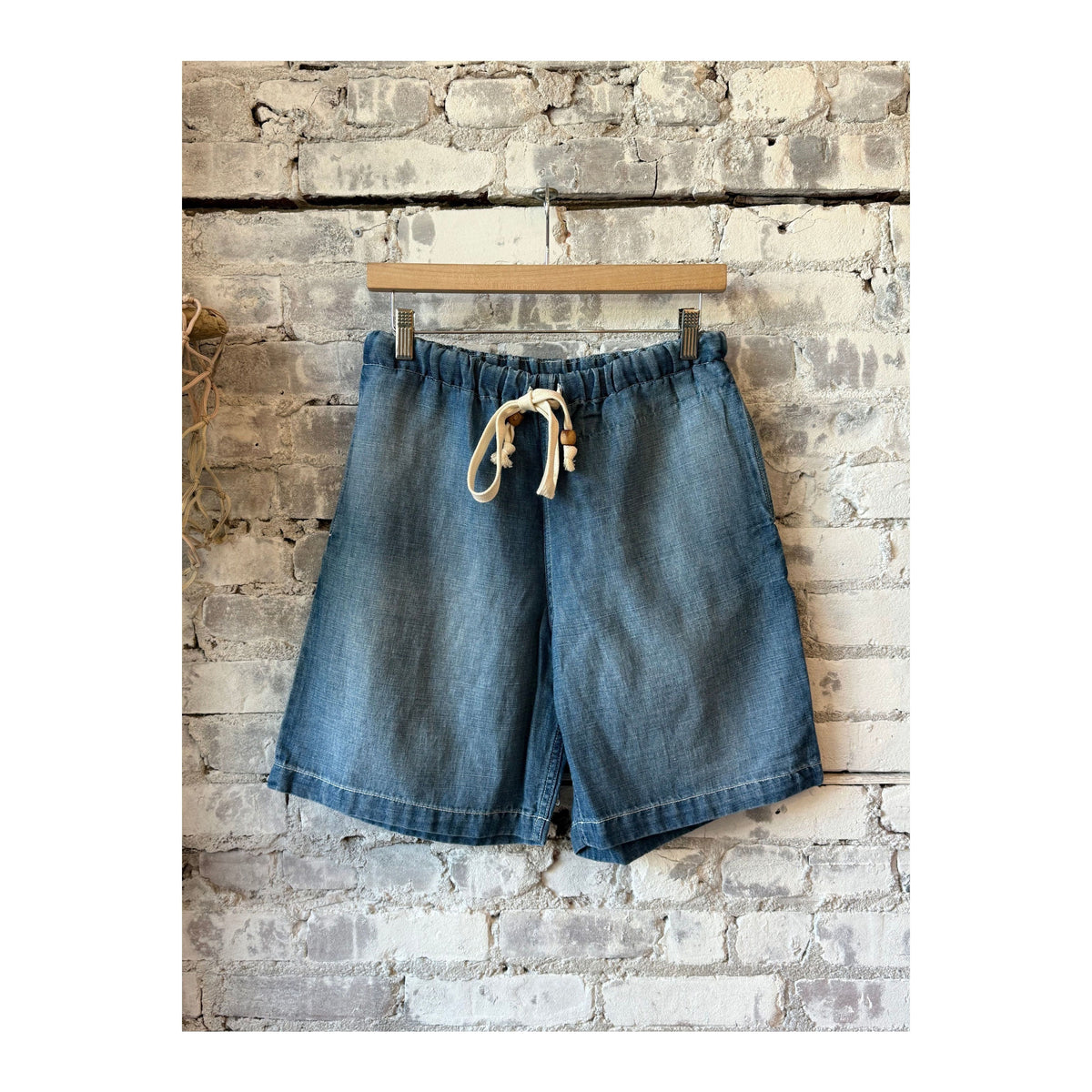 Men's Sunny Afternoon Short in light wash chambray by MONOSTERO, featuring a relaxed fit and casual style.