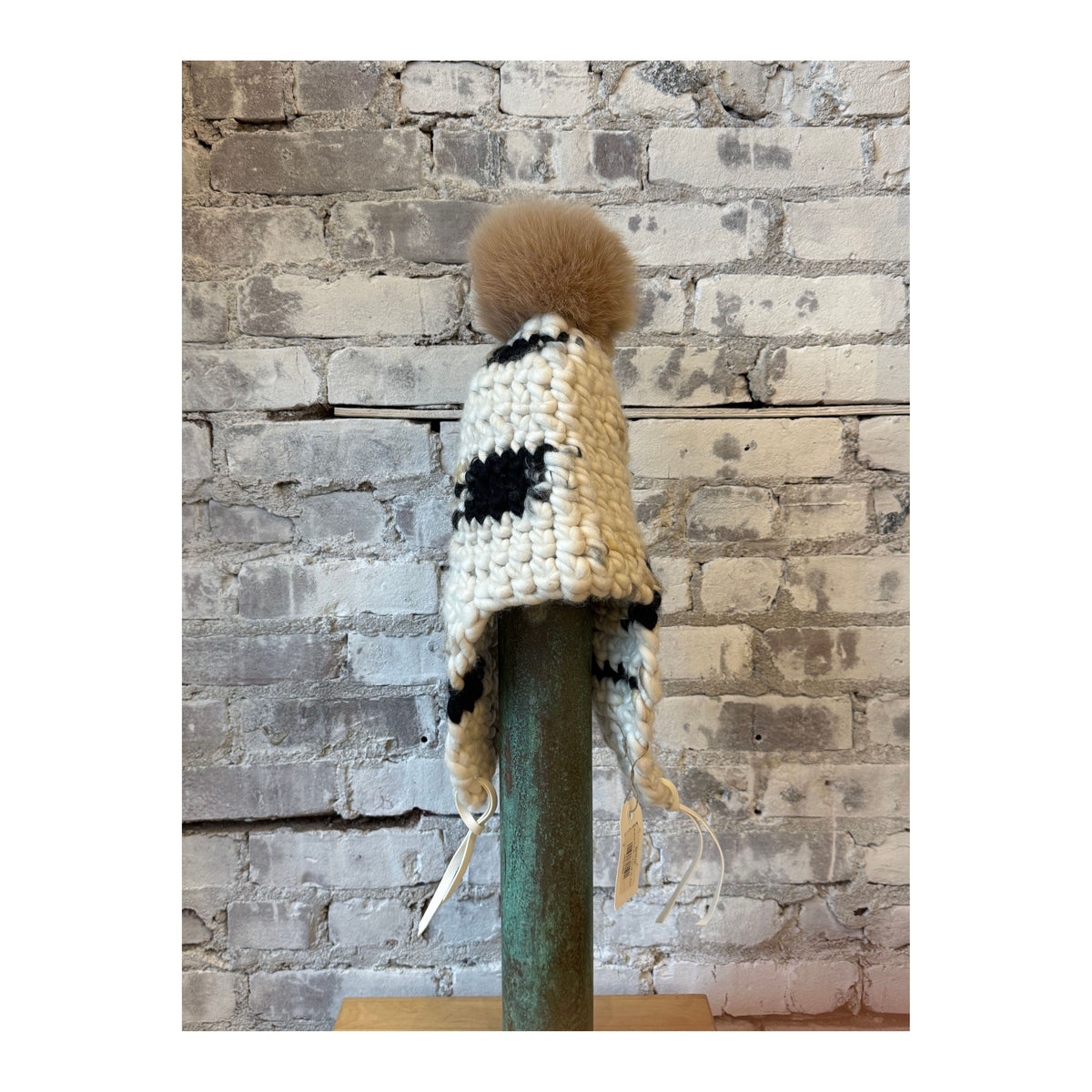 Women's Sunny Fro Tri top and Camel XL Pom hat by Mischa Lampert, featuring bright colors and playful accessories.