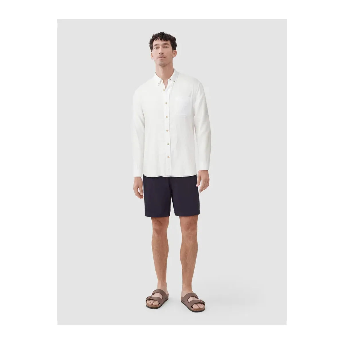 White men's Brian Slub Shirt by Surfside Supply, featuring a relaxed fit and textured fabric, displayed on a hanger.