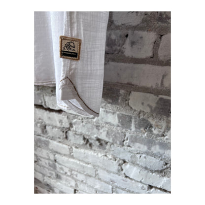 White men's Brian Slub Shirt by Surfside Supply, featuring textured fabric and casual style, displayed on a hanger.