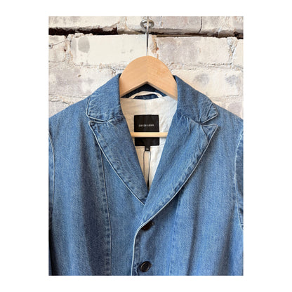 Women's tailored denim blazer in faded blue by Pas De Calais, featuring a fitted style and classic denim texture.