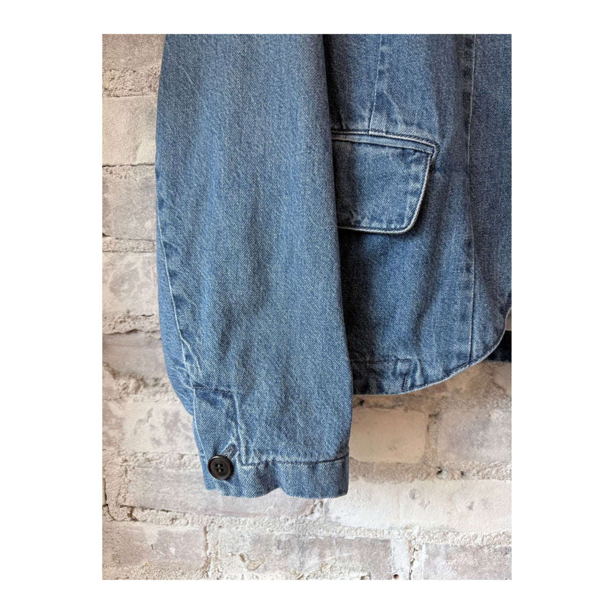 Women's tailored denim blazer in faded blue by Pas De Calais, featuring a fitted style and classic denim texture.