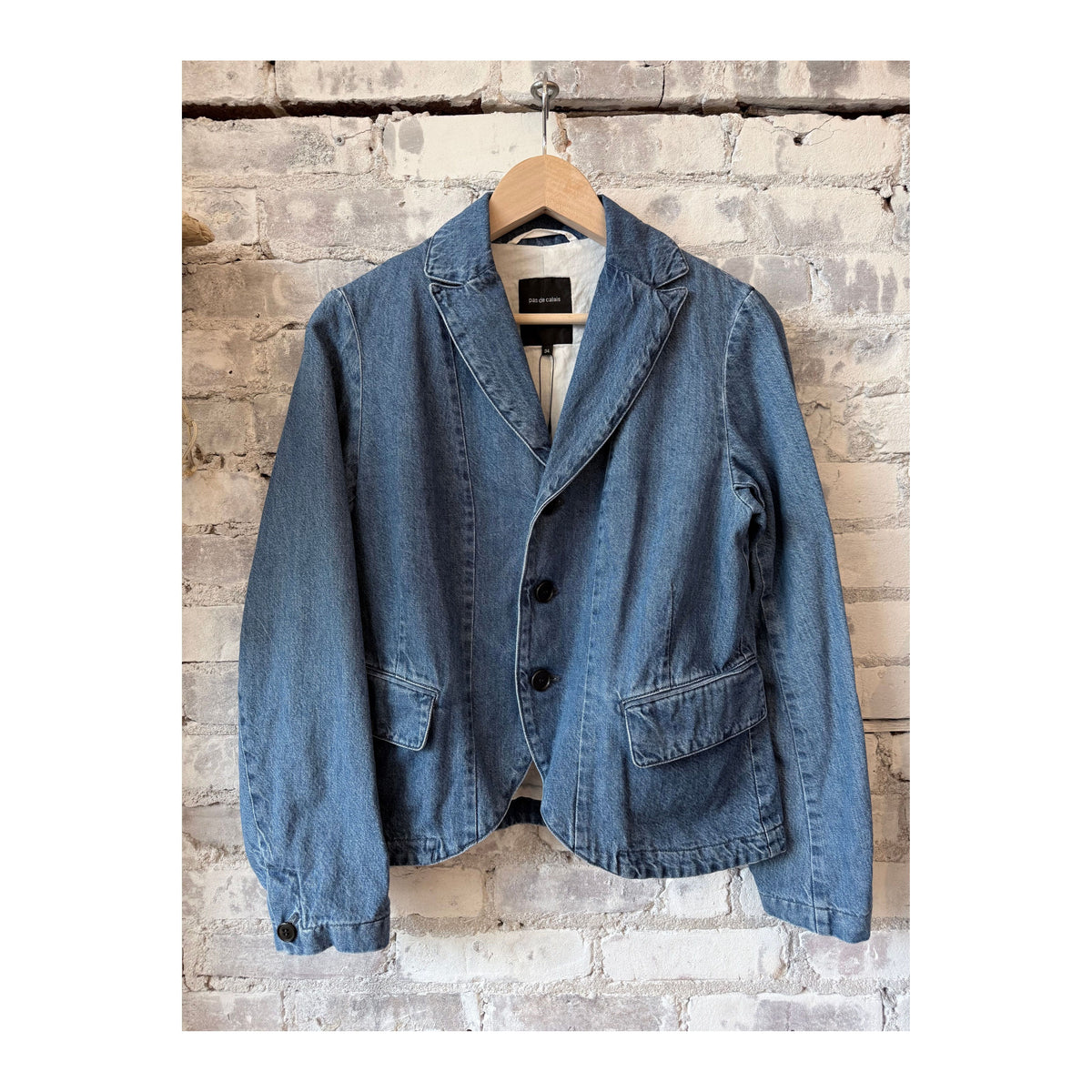 Women's tailored denim blazer in faded blue by Pas De Calais, featuring a fitted design and classic denim texture.