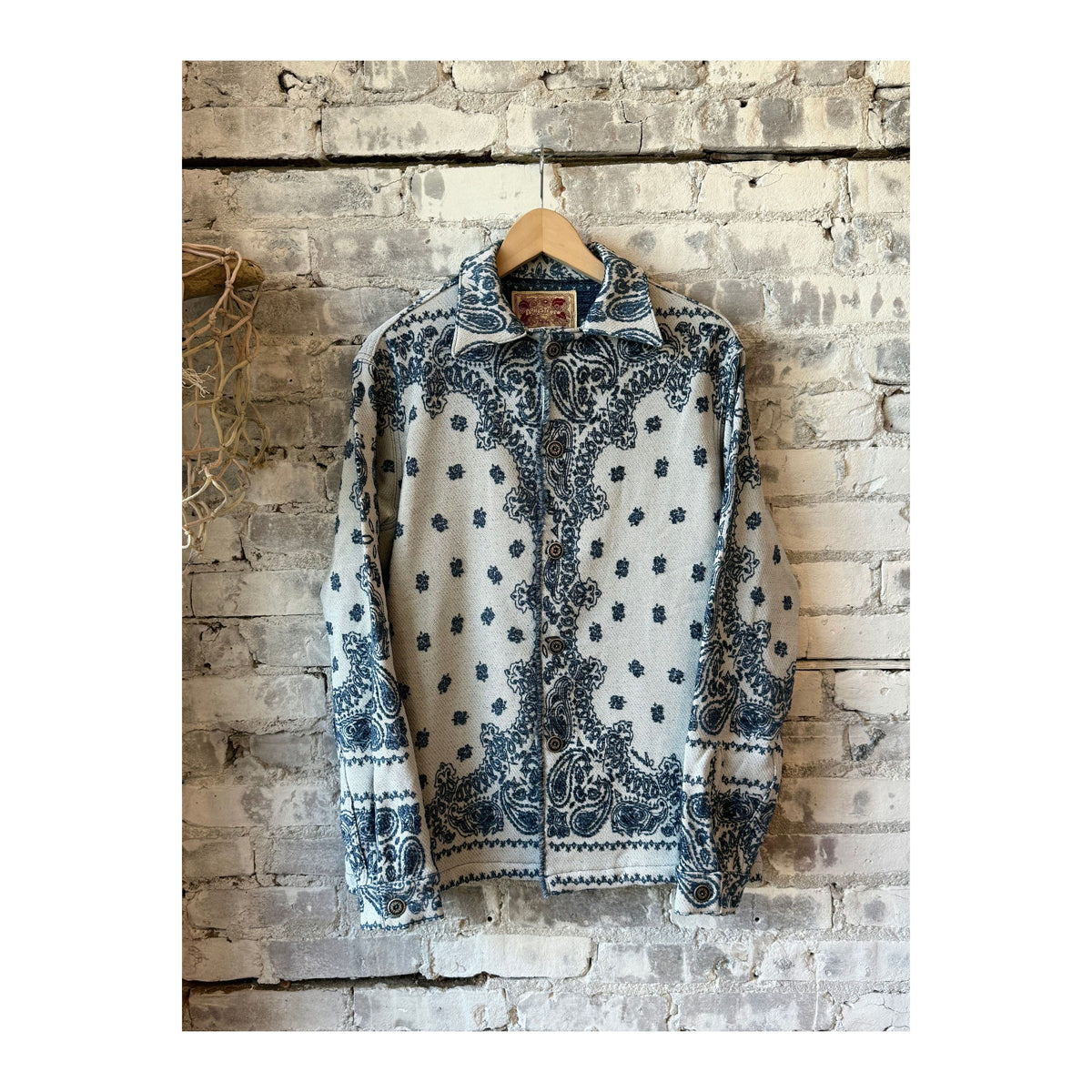 Men's indigo Paisley Blanket Shirt Jacket by MONOSTERO, showing the cozy, patterned fabric and relaxed fit.