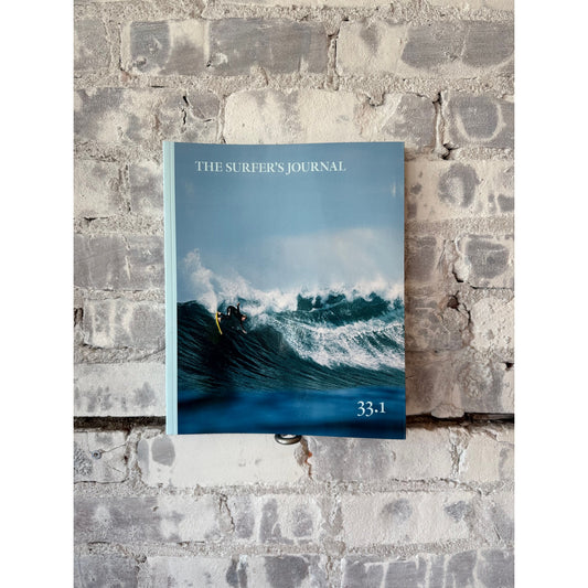 The Surfer's Journal 33 Editions collection of home accessories featuring vintage-style surf-inspired decor and artwork.