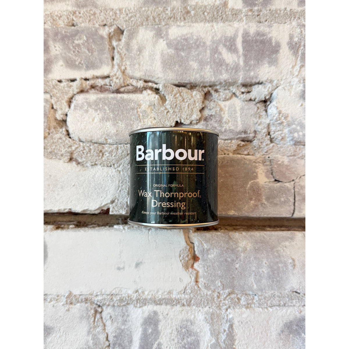 Barbour Thornproof Dressing bottle showing the waterproofing product for clothing and accessories.