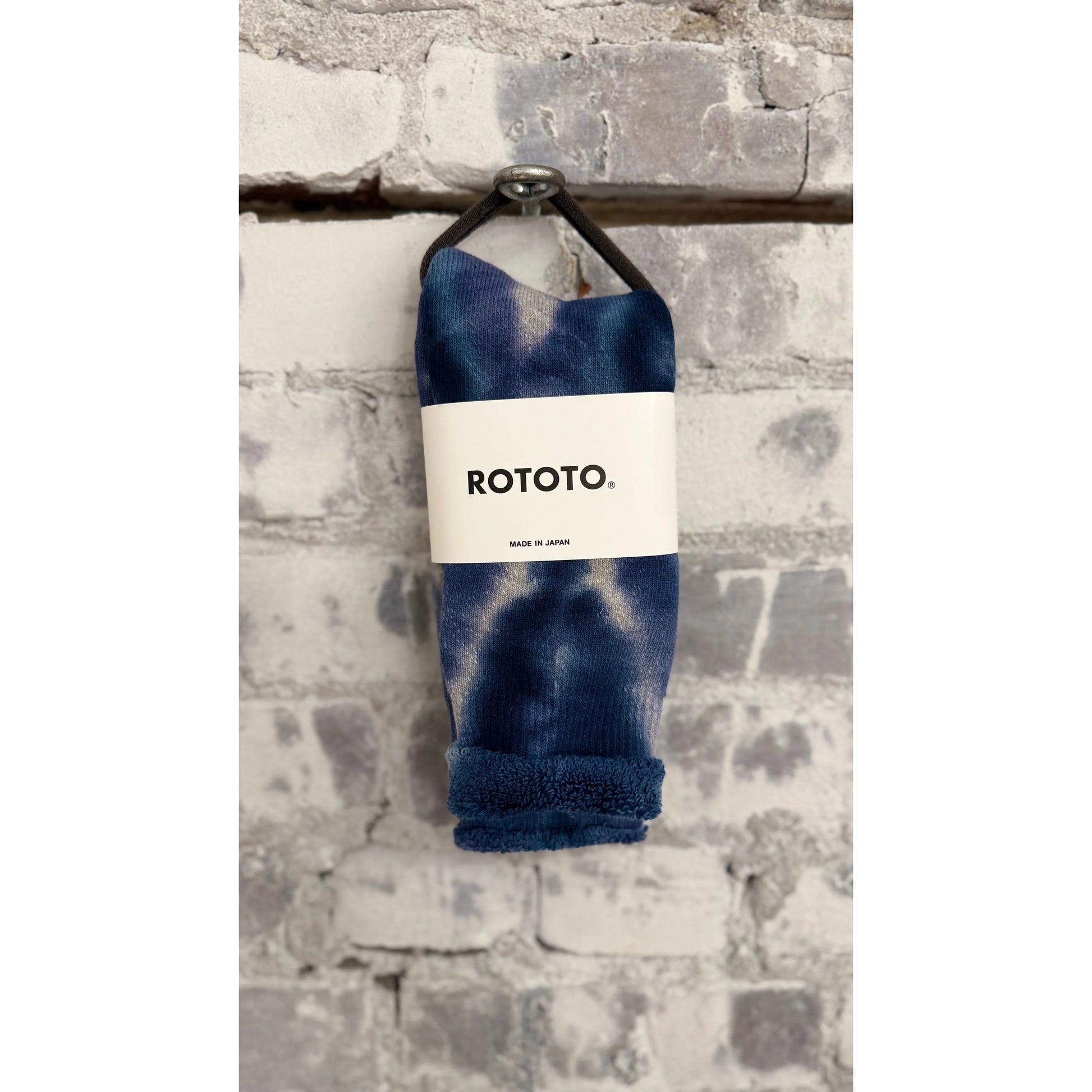 Men's tie dye pile socks in indigo navy by Rototo, featuring soft, textured fabric and vibrant color pattern.
