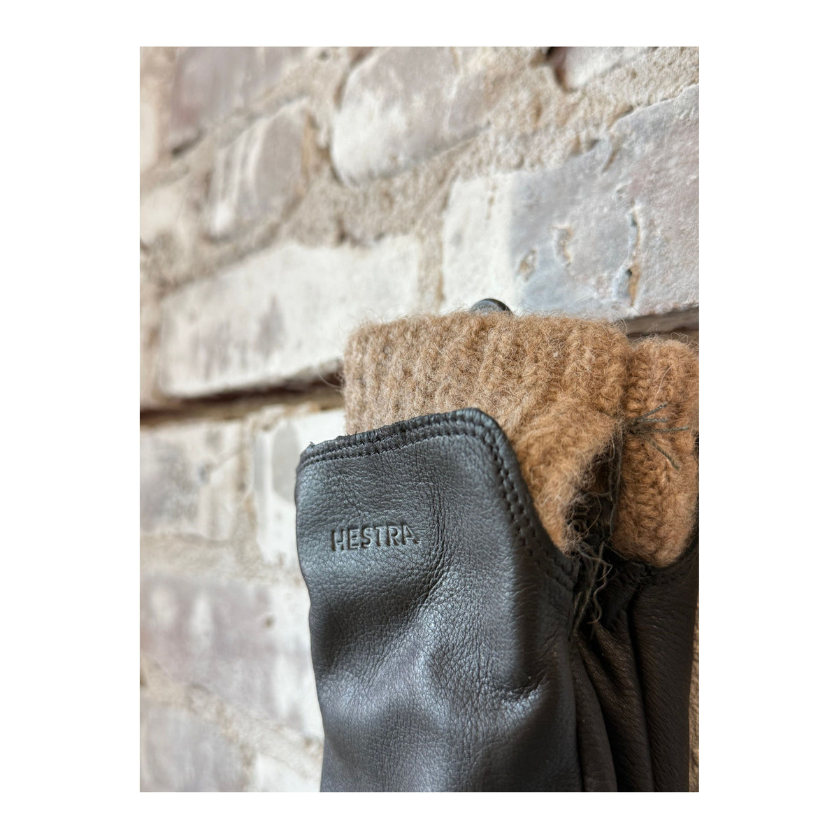 Women's Hestra Tiril Black Glove with leather and knit design, showcasing the stylish and warm winter accessory.