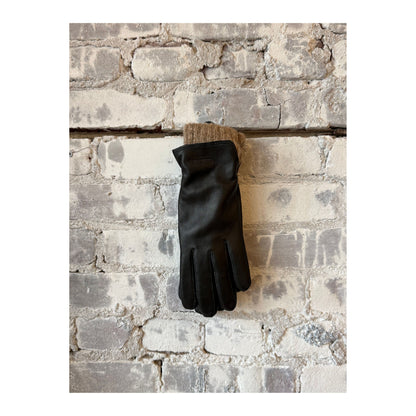 Women's Hestra Tiril Glove in black, showcasing a close-up of the stylish, insulated glove designed for cold weather.