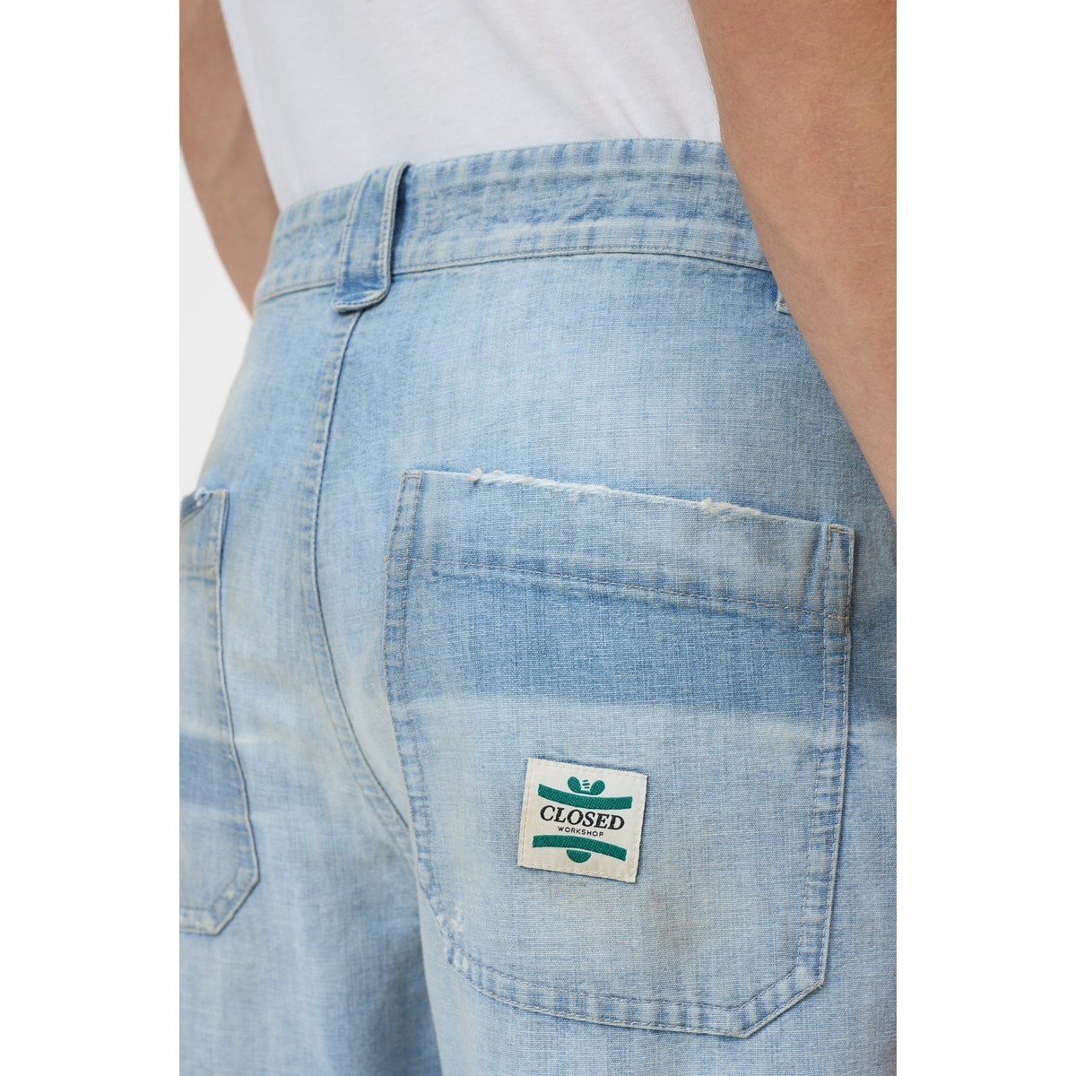 Light blue men's Toledo tapered relaxed jeans by Closed Men's, showing the fit and denim texture on a casual style.
