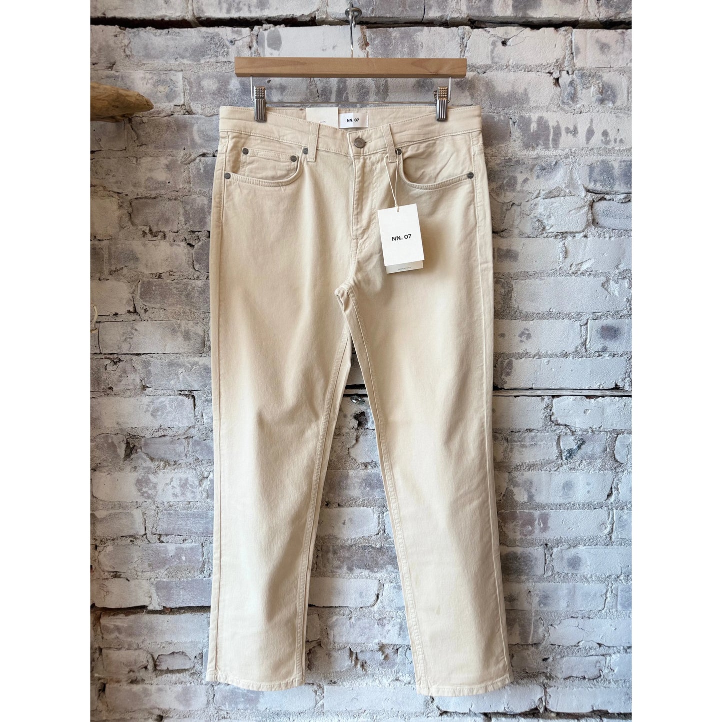 Men's NN07 Tony Classic Slim Fit Ivory Pant, tailored fit with clean design, shown on a hanger against a neutral background.