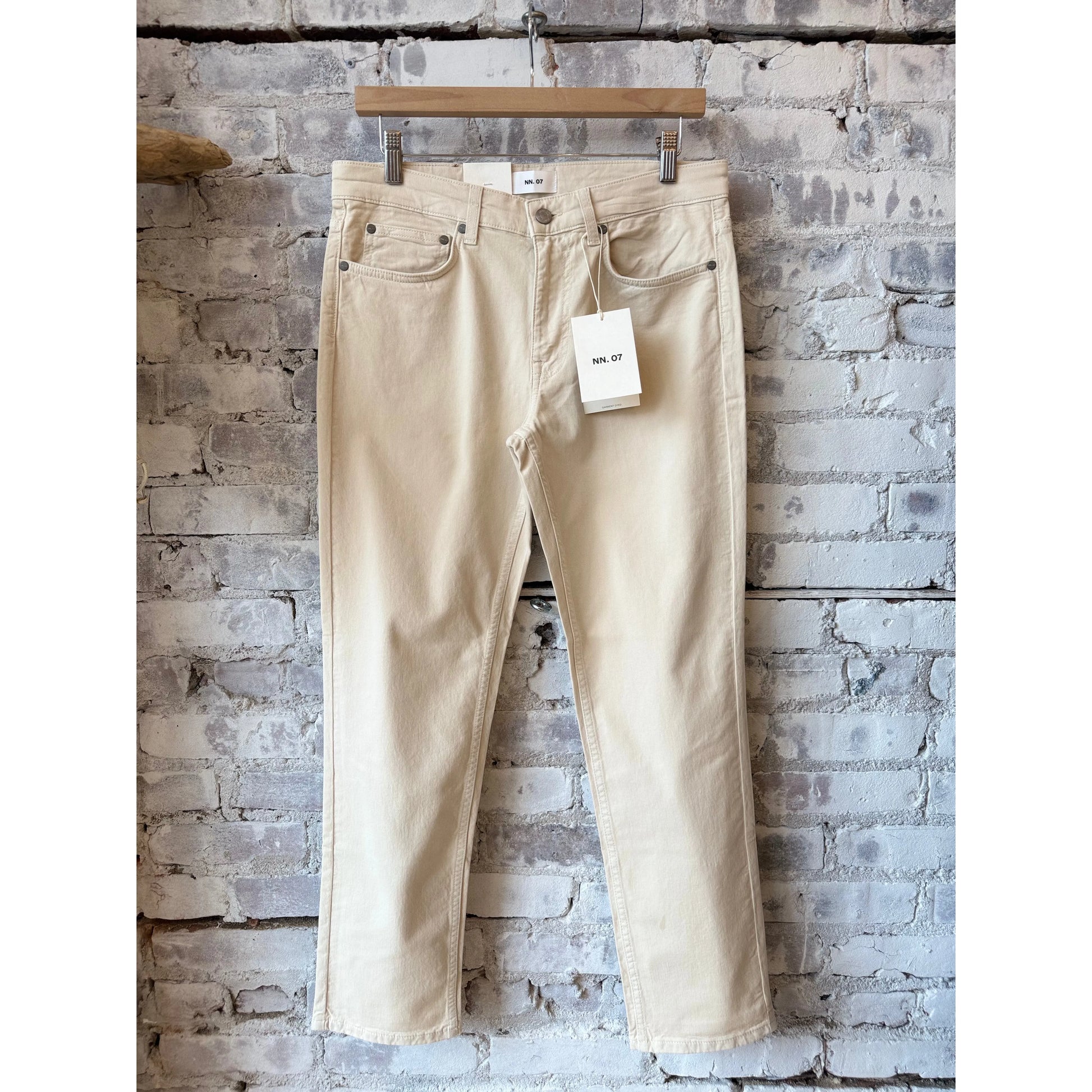 Men's NN07 Tony Classic Slim Fit Ivory Pant, tailored fit with clean design, shown on a hanger against a neutral background.