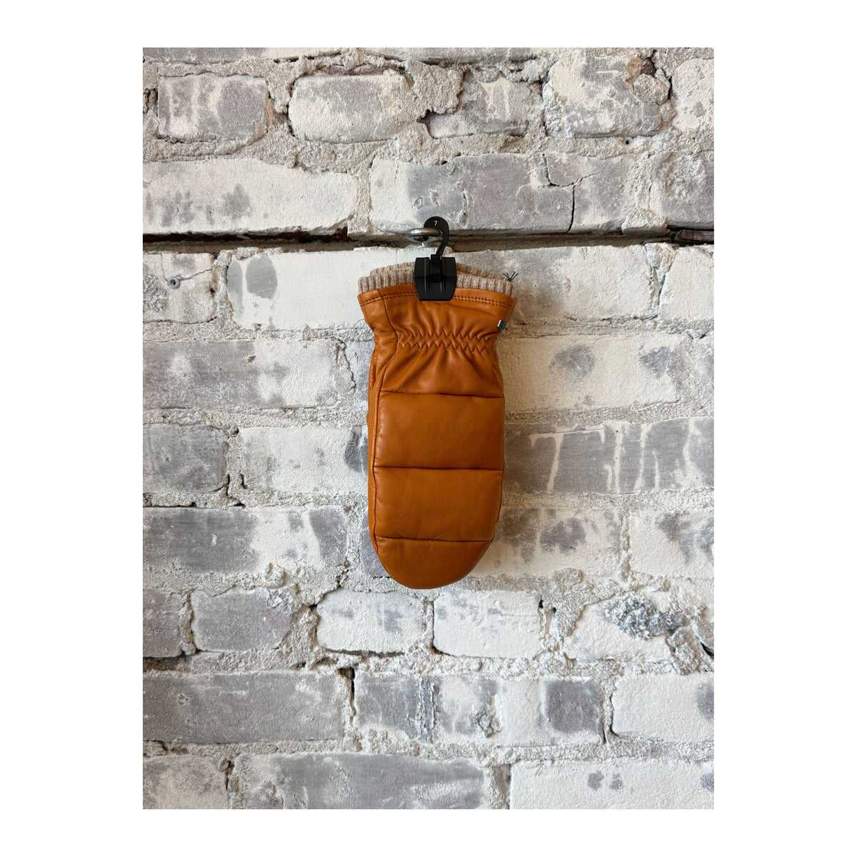 Women's Hestra Torun Mitt made of cork material, showcasing a warm, insulated glove with a stylish design and functional features.