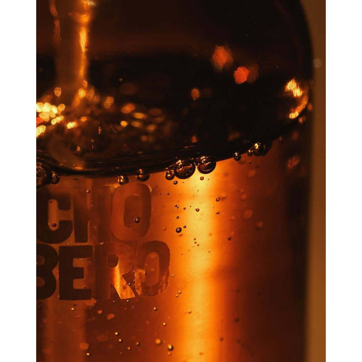 Rancho Bombero total body oil in 8 oz. bottle, showing a sleek container suitable for skin nourishment and massage use.