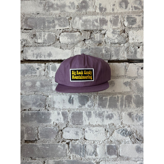 Men's Truckin' Twill Hat in Huckleberry by Big Rock Candy Mountaineering, showing the navy twill fabric and curved brim.