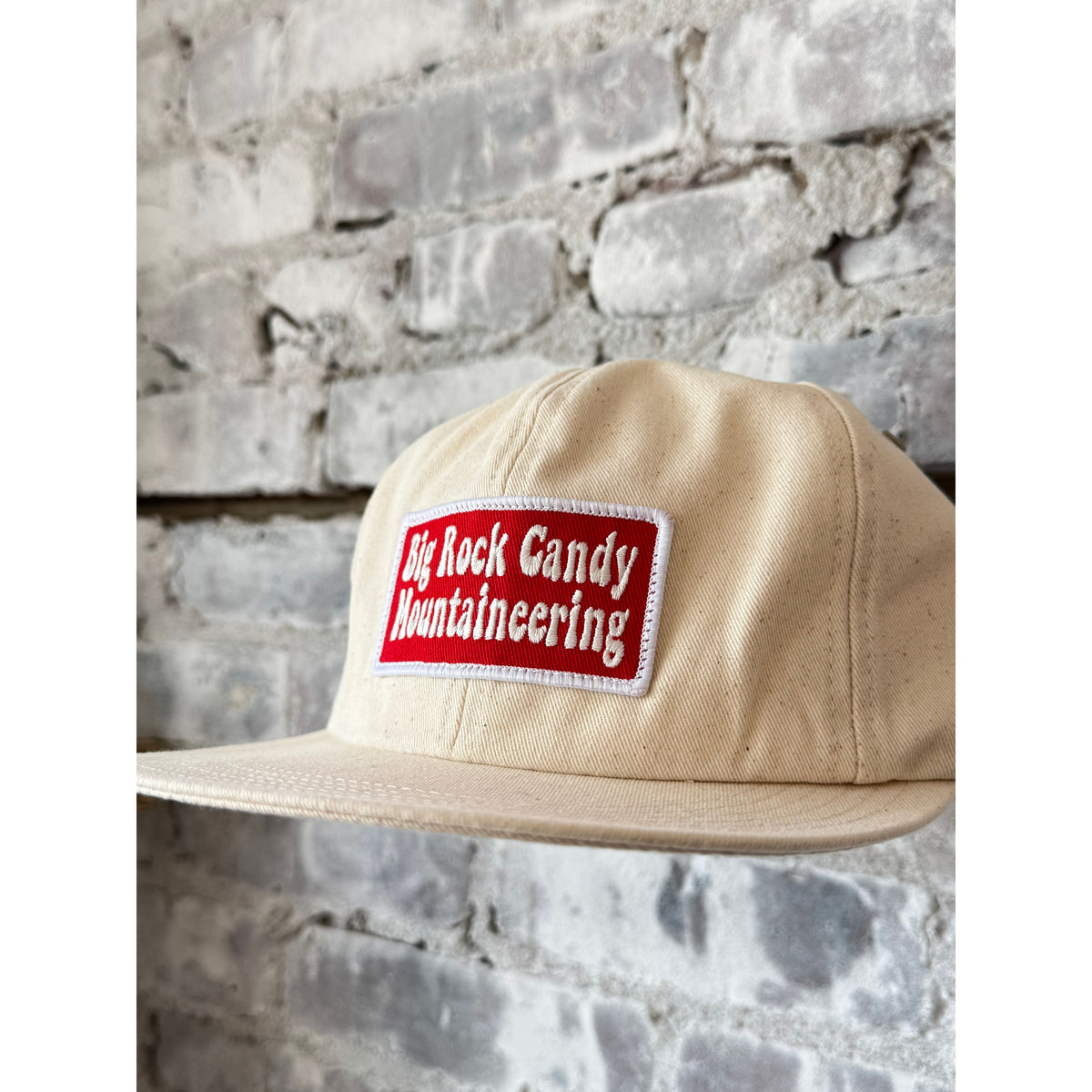 Men's Truckin' Twill Hat in Vanilla Bean by Big Rock Candy Mountaineering, shown in a close-up view.