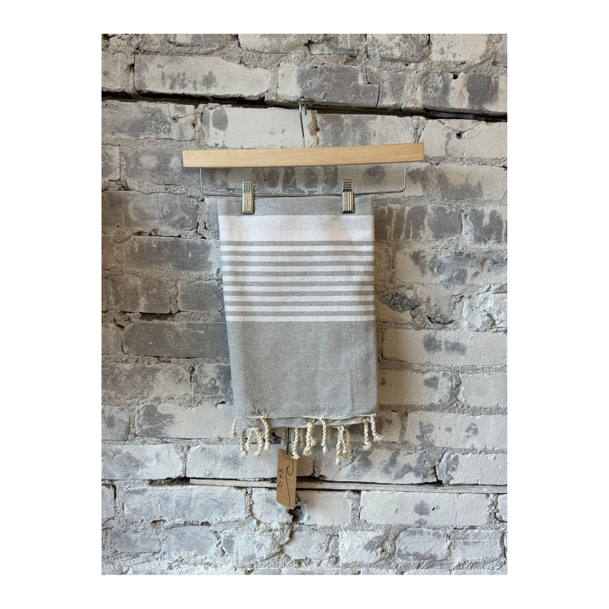 Turkish beach towel by wonderfouta featuring gray and white striped pattern, soft and lightweight for beach or home use.