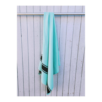 Wonderfouta Turkish beach towel sarong in aqua and black with intricate patterns, perfect for beach or home use.