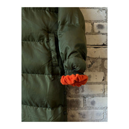 Women's TWIN 06 Long Puffer Coat in military orange, featuring a trendy, insulated design for cold weather comfort.