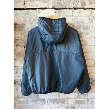 Women's navy two-tone nylon reversible jacket by Aspesi, showing the stylish two-tone design and lightweight material.