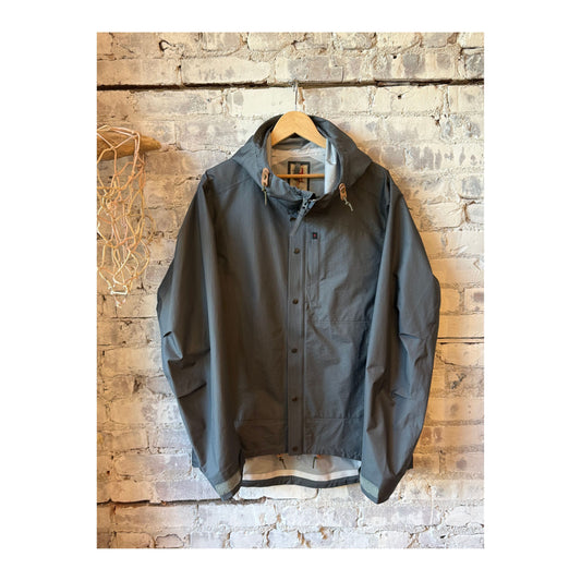 Men's Ultra Rain Shell by Relwen in charcoal, lightweight waterproof jacket with hood and adjustable cuffs, casual outdoor wear.