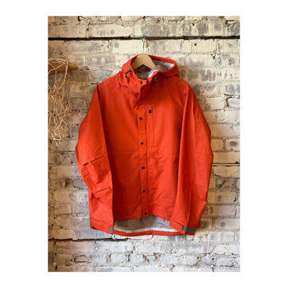 Men's orange Ultra Rain Shell by Relwen, lightweight waterproof raincoat with hood and adjustable cuffs, outdoor rain protection.