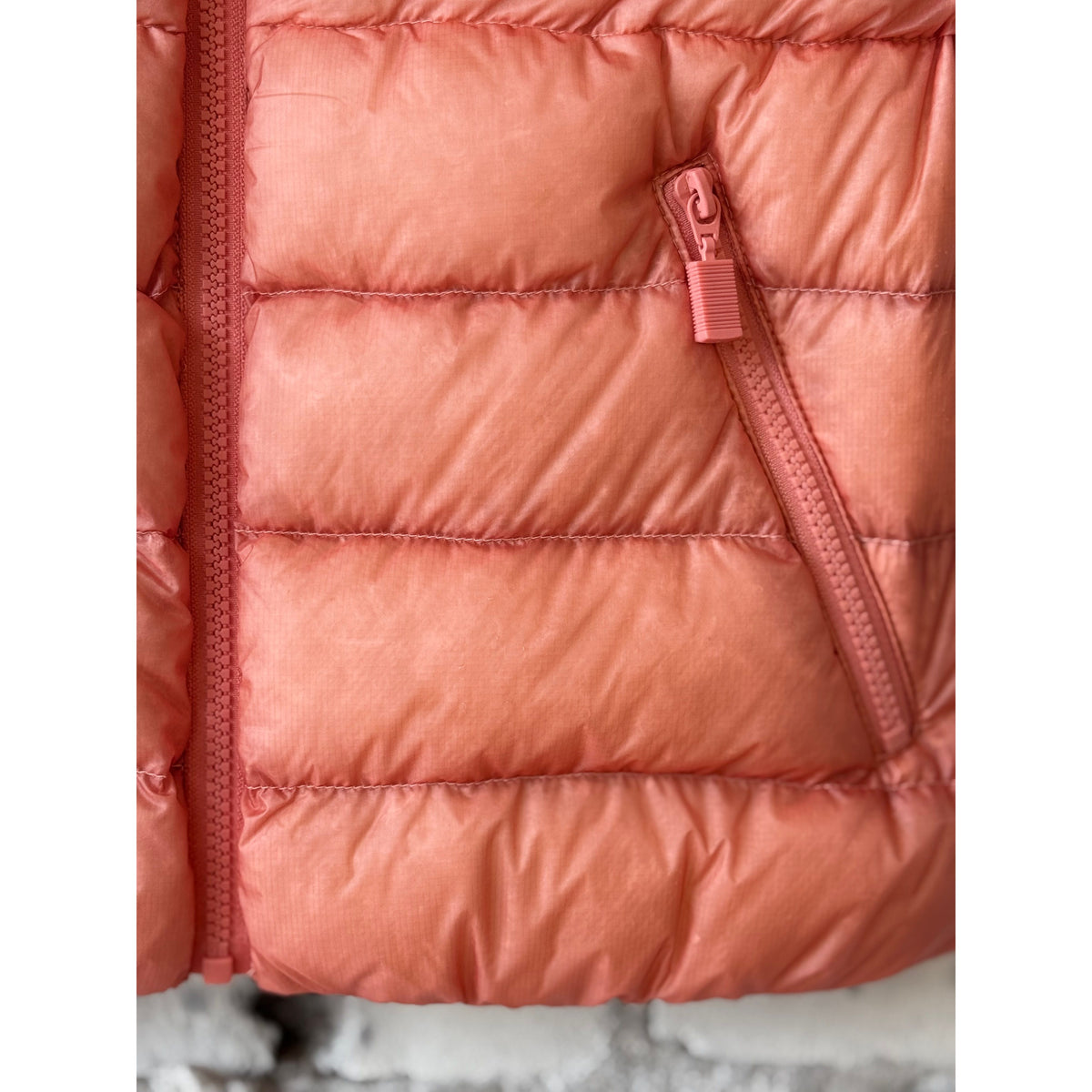 Women's Aspesi ultralight ripstop nylon vest in powder pink, showing lightweight fabric and sleek design.