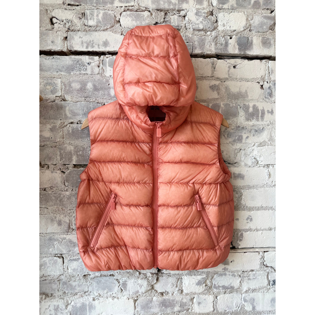 Women's ultralight ripstop nylon vest in powder pink by Aspesi, featuring a sleek, lightweight design for outdoor wear.