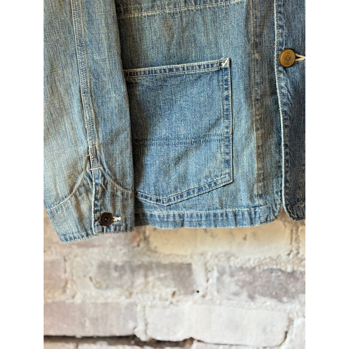 Unisex 11oz selvedge denim chore jacket by Chimala, men's style with durable fabric and classic design, shown in close-up view.