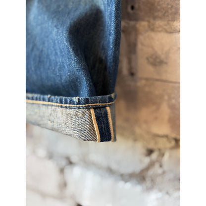 Unisex 13.5oz dark engineer selvedge denim straight cut jeans by Chimala, showing the fit and dark indigo denim fabric.