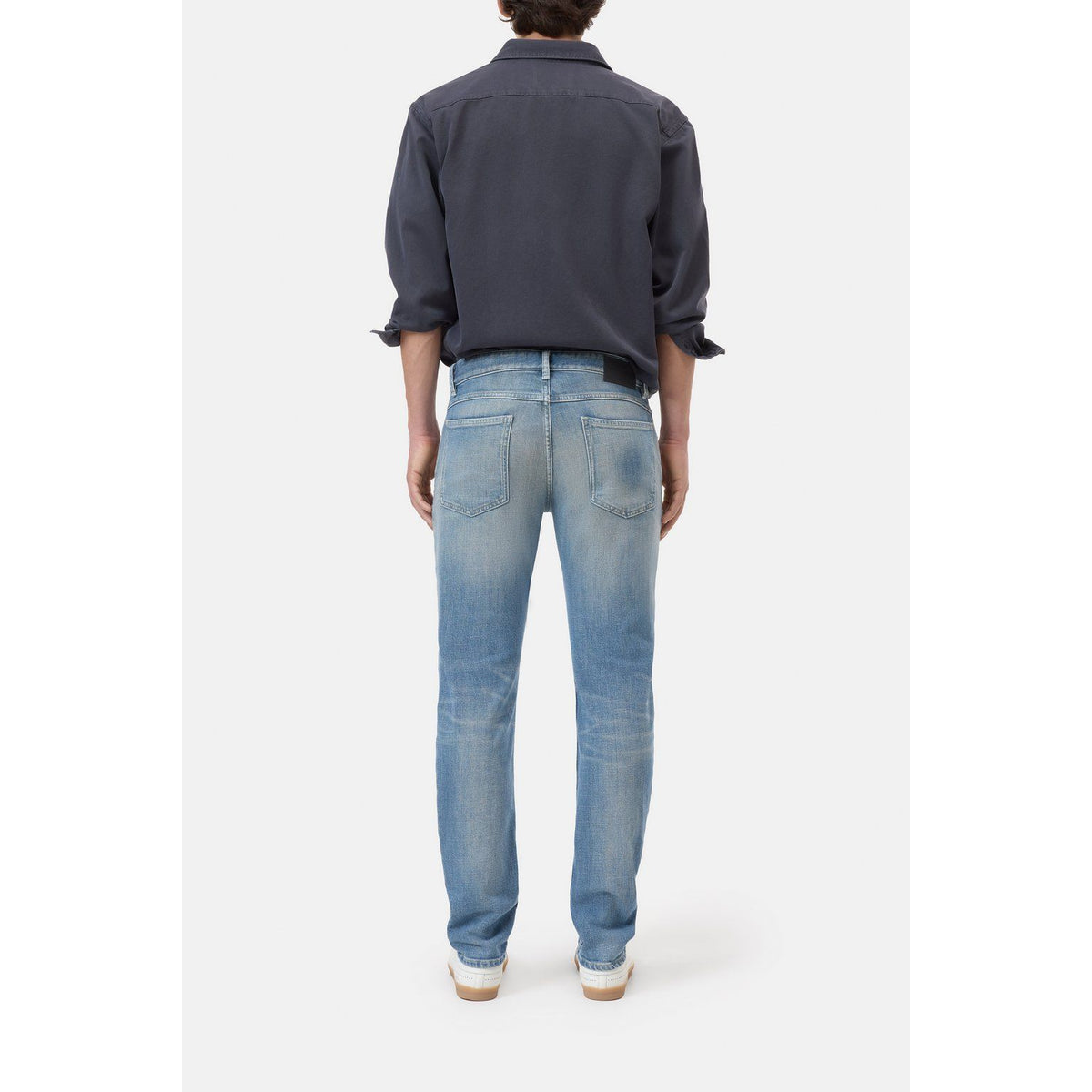 Men's Unity Slim Jean in mid blue from Closed Men's, featuring a classic slim fit and denim fabric.