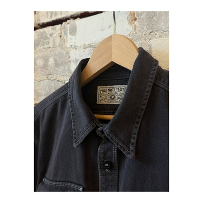 Men's charcoal utility twill shirt by Freenote Cloth featuring a button-up design and rugged fabric texture.