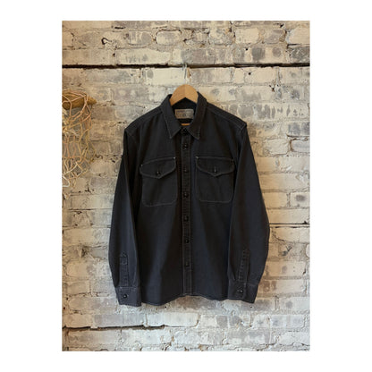 Men's charcoal utility twill shirt by Freenote Cloth, featuring a button-up design and classic fit, displayed on a hanger.