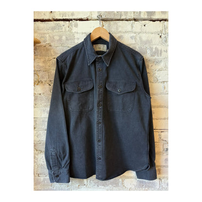 Men's navy Utility Twill Shirt by Freenote Cloth, featuring a rugged twill fabric and classic fit, displayed on a hanger.