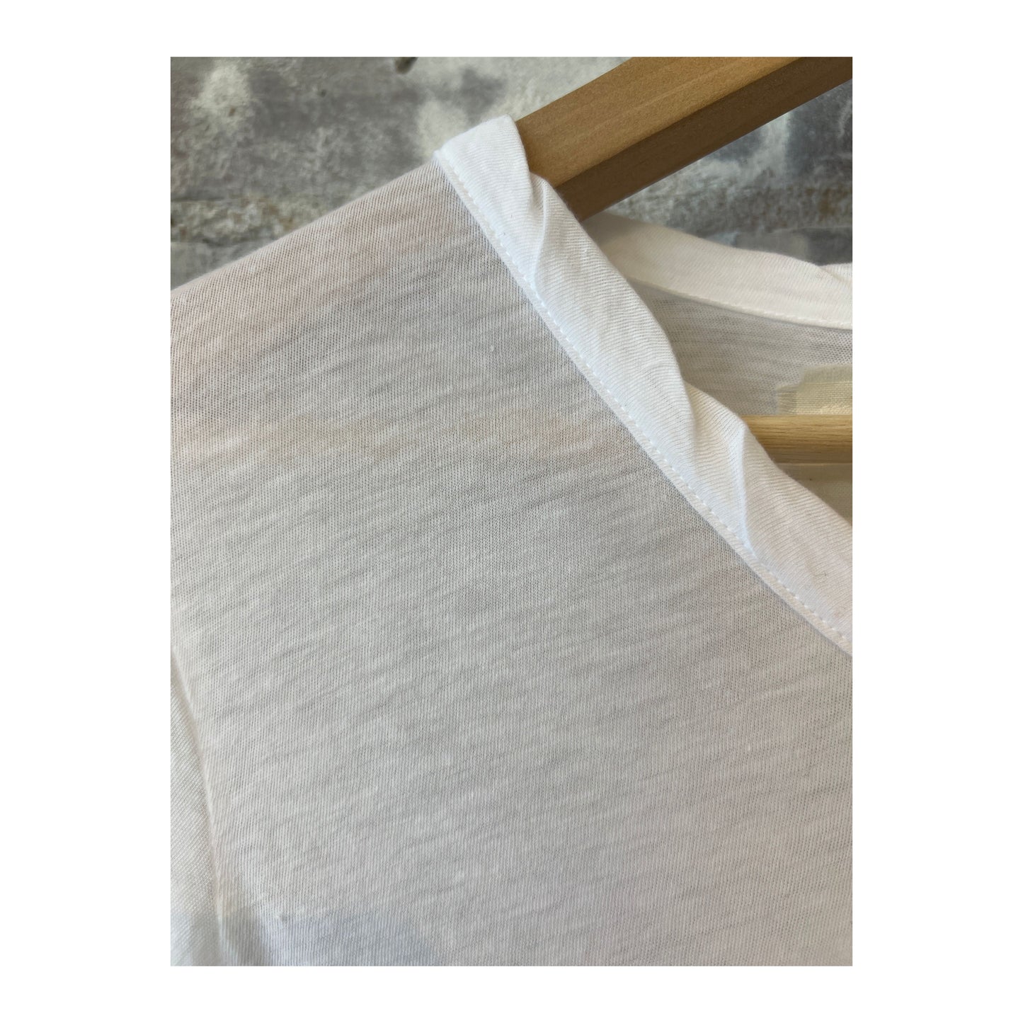 Women's white Hi-Soft Jersey LS Crew top by V::Room, long-sleeve, soft fabric, casual style, close-up of the shirt's front.