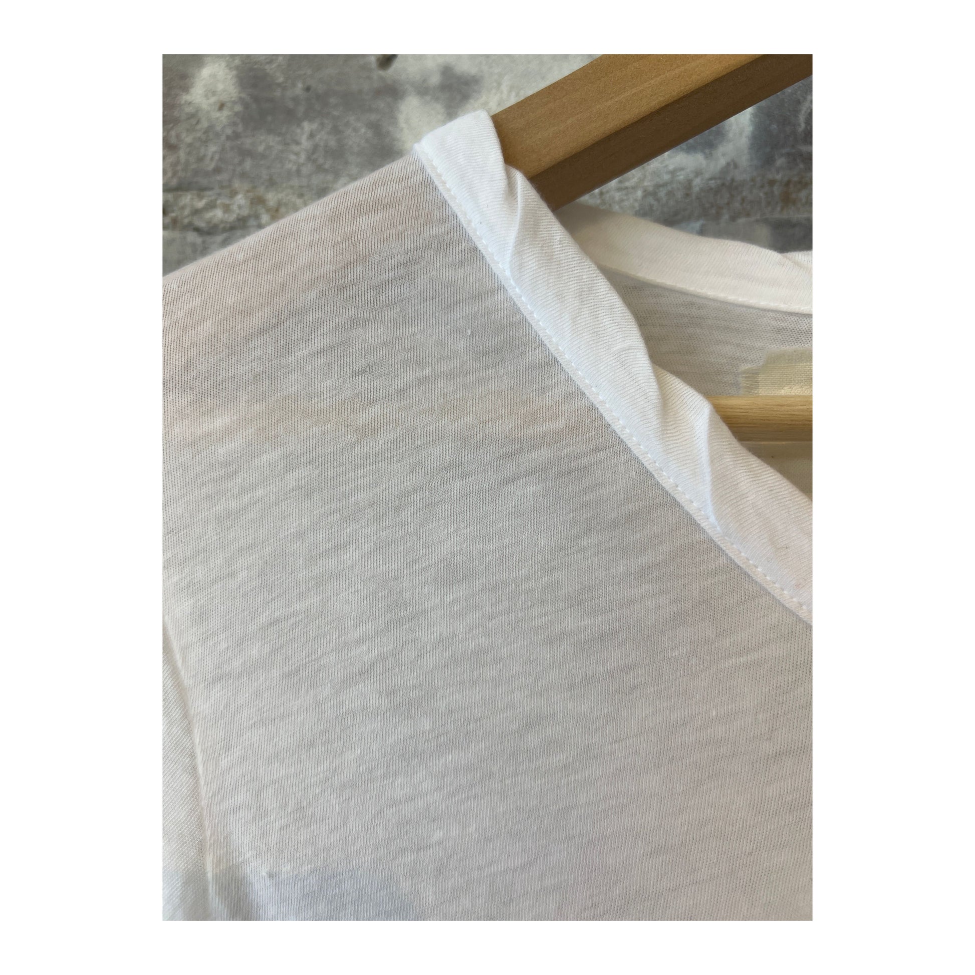 Women's white Hi-Soft Jersey LS Crew top by V::Room, long-sleeve, soft fabric, casual style, close-up of the shirt's front.