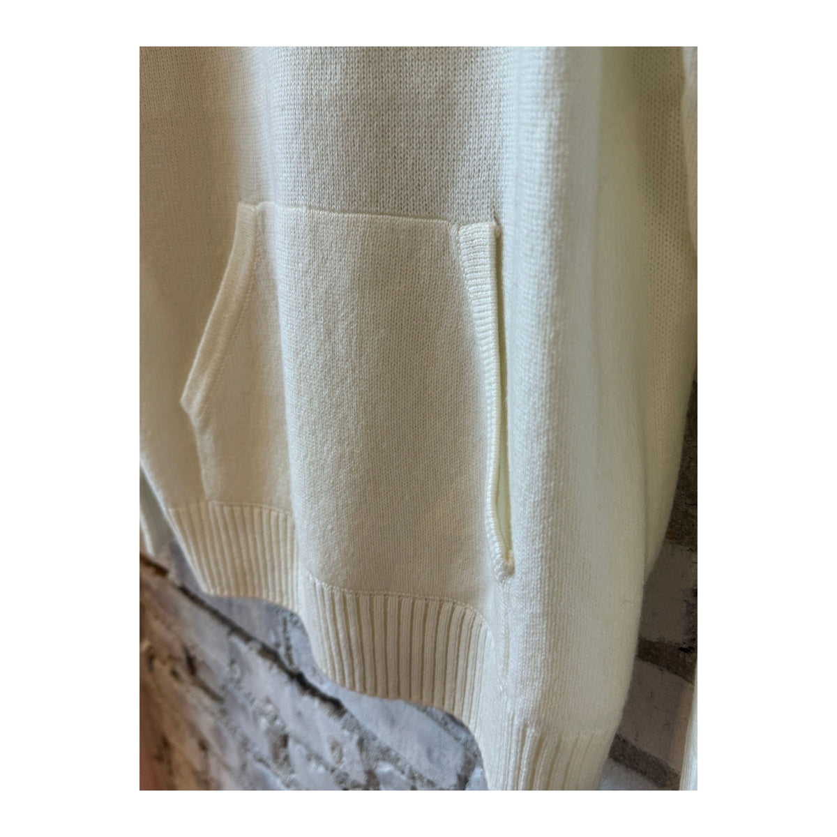 Women's ivory Merino Jersey Knit Loose Hoodie by V::Room, showcasing the relaxed fit and soft, cozy fabric.