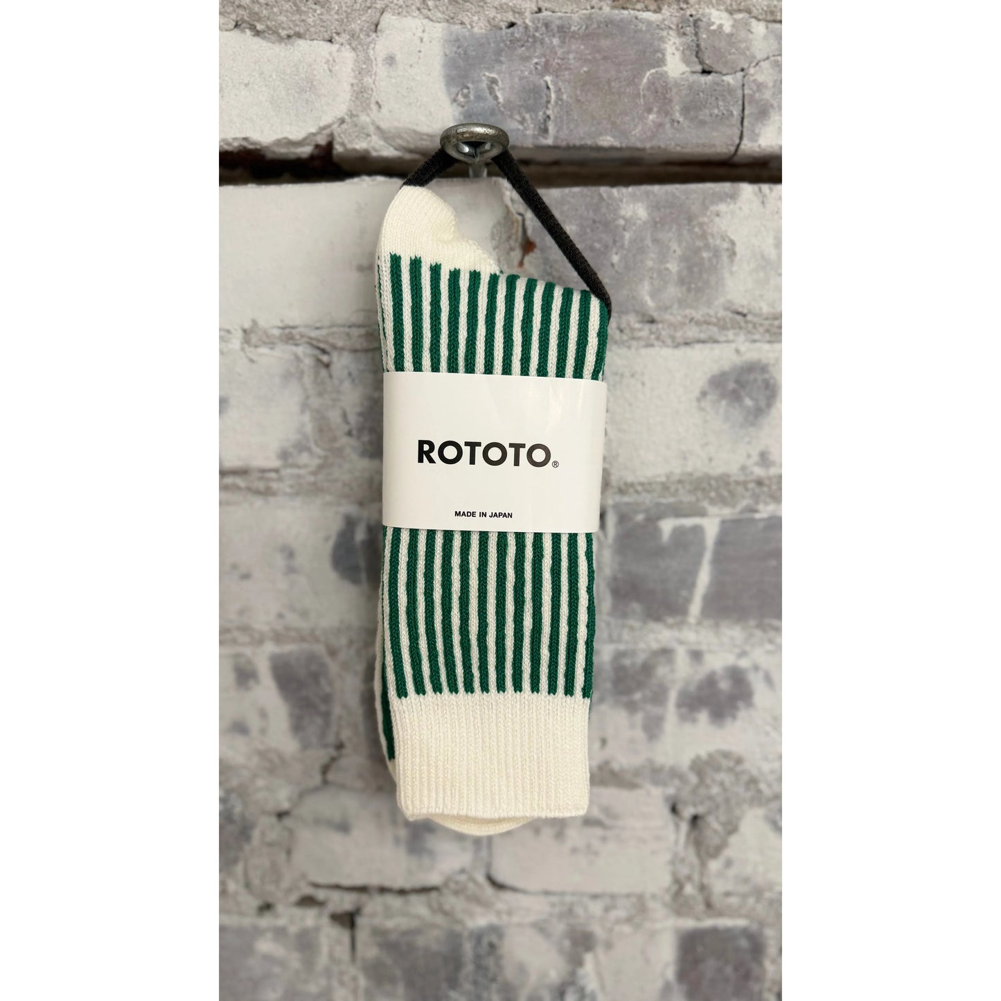 Men's vertical striped socks by Rototo in white and green, featuring a classic pattern and comfortable fit.