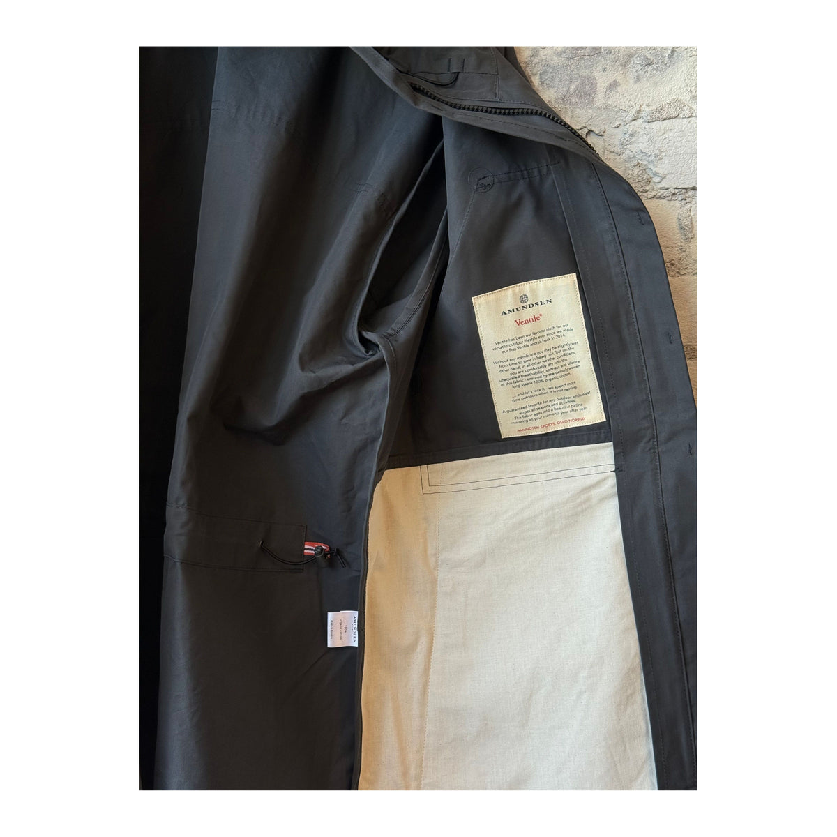 Men's Amundsen Vidda Unisex Jacket in charcoal, lightweight and durable with a high collar and zipper closure.