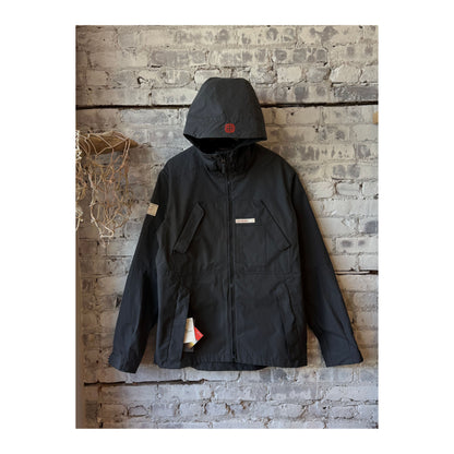 Men's Amundsen Vidda Unisex Jacket in charcoal, showcasing the dark, durable outdoor jacket with a hood and outdoor-ready design.