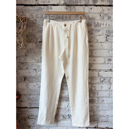Men's Vigo tapered linen pants by Closed Men's in ivory, featuring a relaxed fit and tapered leg style.
